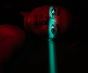 Atmospheric cyan light reflecting on a dark wall